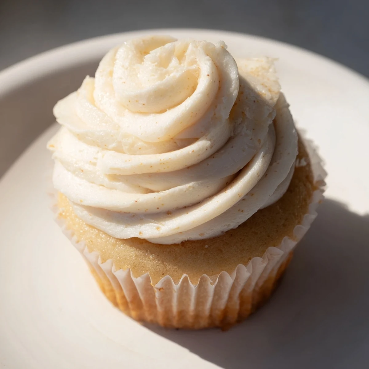 Fluffy vanilla cupcakes with generous buttercream frosting, ready to be enjoyed!
