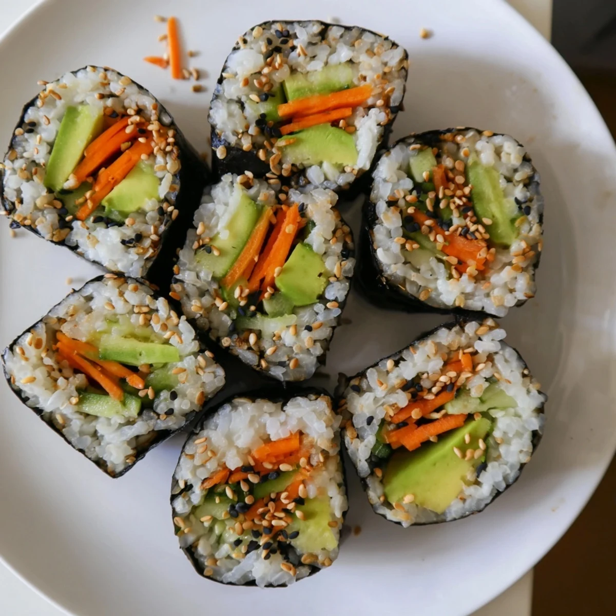 These simple veggie Avocado Cucumber Sushi rolls feature a colorful mix, ready for dipping sauces.