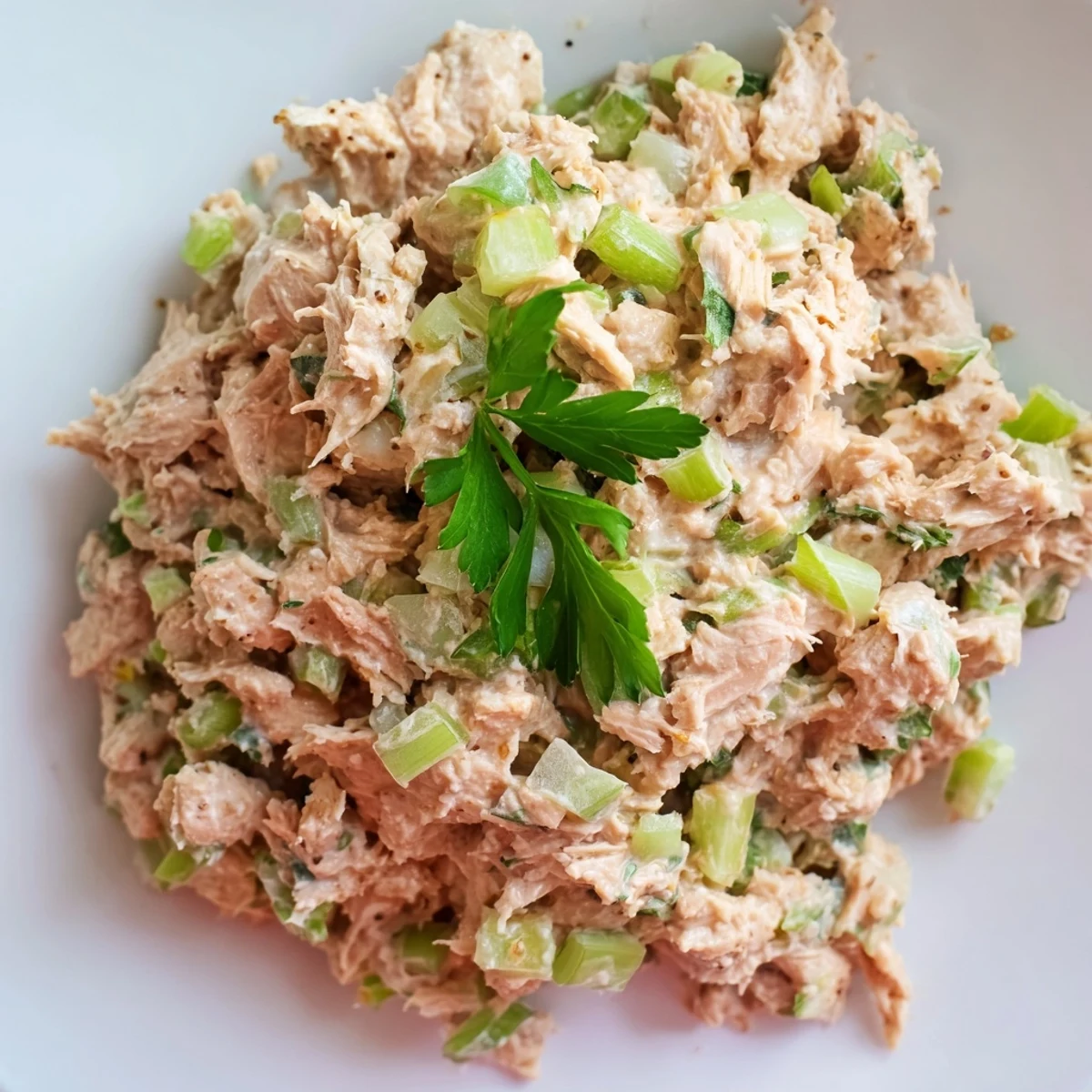 Bright red Sriracha mayo coats flaky tuna, mixed with crisp green scallions in this Spicy Zesty Tuna Salad.