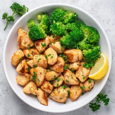 Vibrant image of Microwave-Steamed Chicken and Broccoli, seasoned with paprika, perfect for a quick dinner.