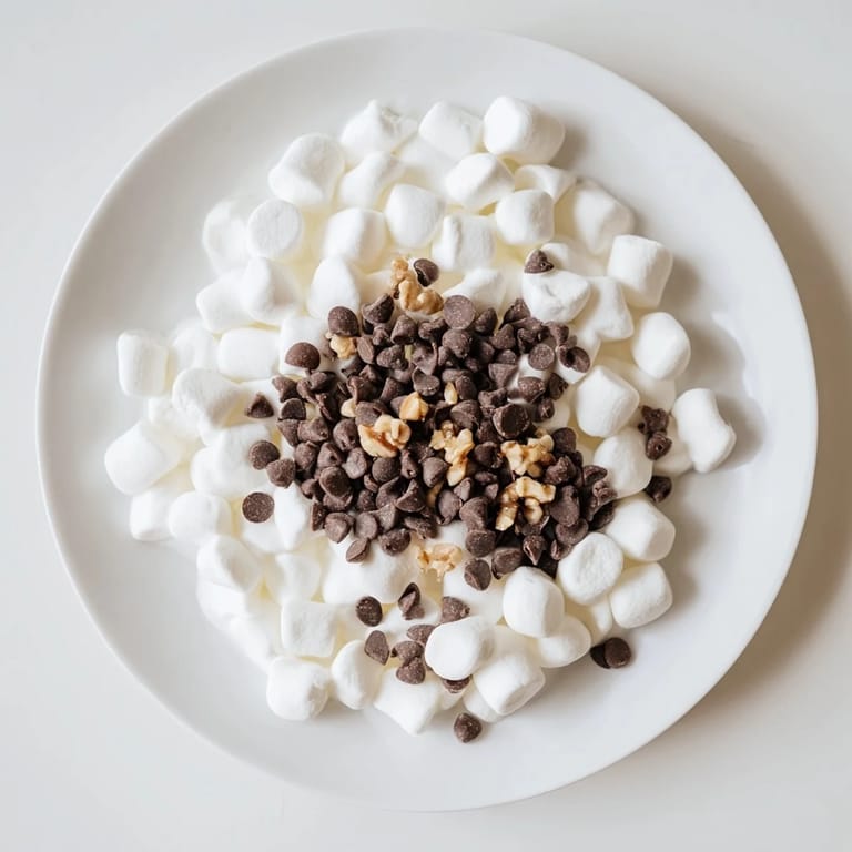 A delicious quick dessert—Chocolate Chips and Mini Marshmallows Heap—with a melty dark chocolate texture.