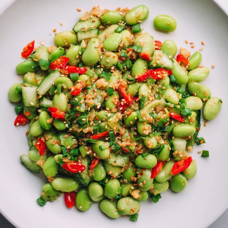 Chilled edamame salad with cucumber, sesame seeds and a fragrant ginger-infused dressing.