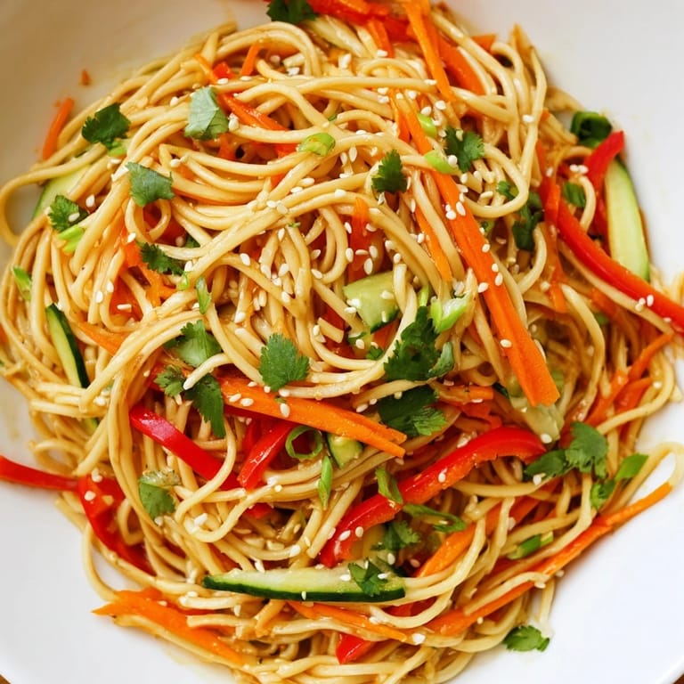 Delectable fresh Garlic Noodle Salad with crunchy carrots and a savory soy-garlic dressing.