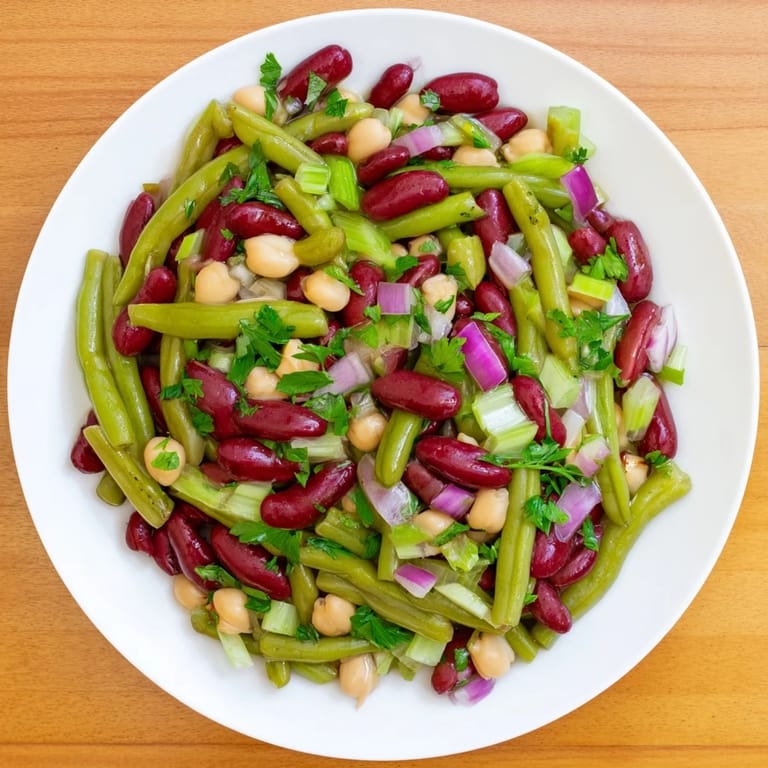 Chilled Three-Bean Salad served as a colorful side dish, perfect for potlucks, picnics, and healthy vegetarian meals.